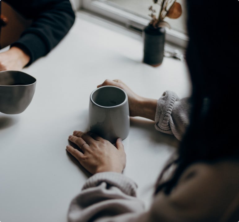 Two people drinking hot drink